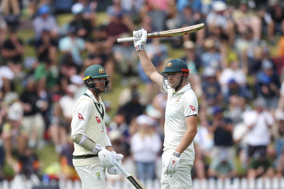 WELLINGTON, NEW ZEALAND - MARCH 01: Cameron Green of Australia celebrates his 150 with Josh Hazlewood during day two of the First Test in the series between New Zealand and Australia at Basin Reserve on March 01, 2024 in Wellington, New Zealand. (Photo by Hagen Hopkins/Getty Images)