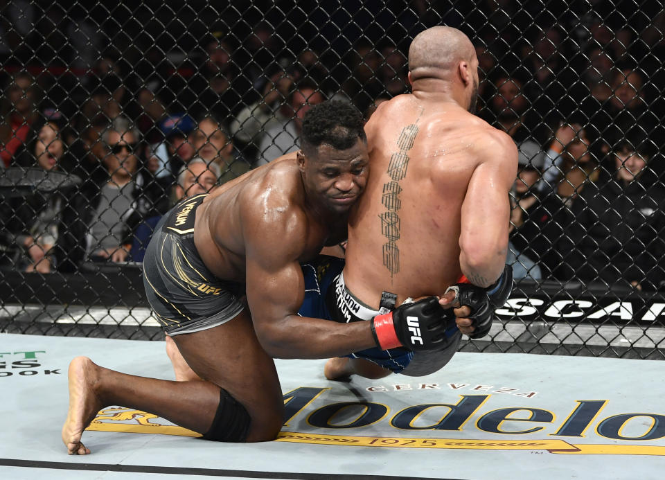 ANAHEIM, CALIFORNIA - JANUARY 22: (L-R) Francis Ngannou of Cameroon takes down Ciryl Gane of France in their UFC heavyweight championship fight during the UFC 270 event at Honda Center on January 22, 2022 in Anaheim, California. (Photo by Chris Unger/Zuffa LLC)