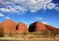 <p>No journey to Uluru-Kata Tjuta National Park is complete without a visit to Kata Tjuta - or ‘the Olgas.’ This unique formation of domed rocks huddled together - there are 36 boulders in total - is around 35km west of Uluru. The tallest rock is approximately 200m higher than Uluru and combined they form deep valleys and steep gorges. The 7.4km Valley of the Winds loop is a great bush walk that cuts through the winding gorges. It takes 2-4 hours, depending on your fitness level.</p>