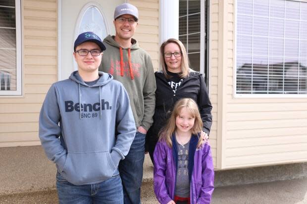 From left to right, Caedon, Shawn, Andrea and Aubrey Bergen. Andrea Bergen says it took months for her family to find the right home. (Jamie Malbeuf/CBC - image credit)