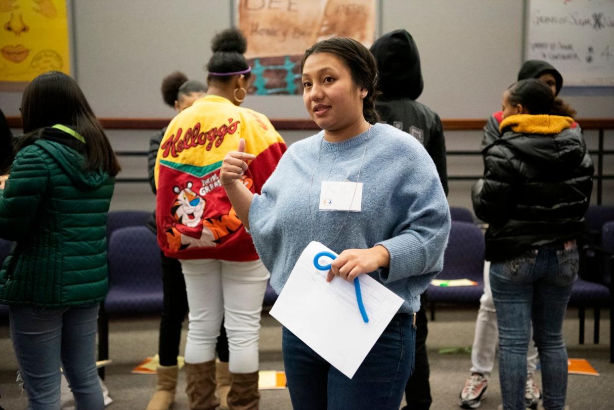 Tha Par, executive director for the Burma Center conducts a concentric circle exercise during Battle Creek's Coalition for Truth, Racial Healing and Transformation Youth Summit in January 2020 at W.K. Kellogg Foundation in Battle Creek.