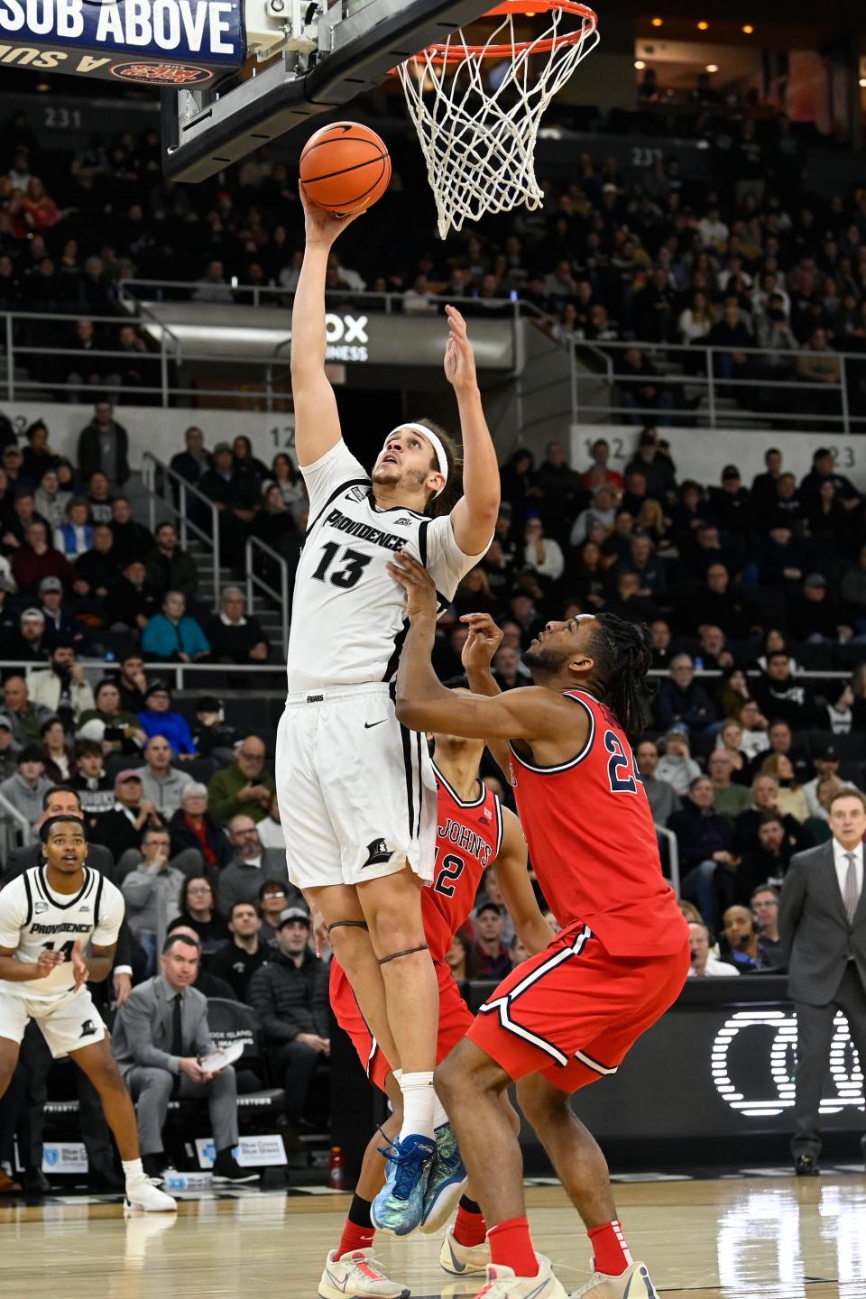 Providence Friars forward Josh Oduro goes to the basket against St. John's during the first half.