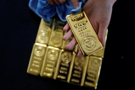 Gold dips on firmer dollar