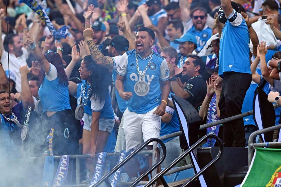 May 20, 2023; Charlotte, North Carolina, USA; Charlotte FC fans celebrate goal in the first half to put them up 1-0 over Nashville SC at Bank of America Stadium. Mandatory Credit: Griffin Zetterberg-USA TODAY Sports