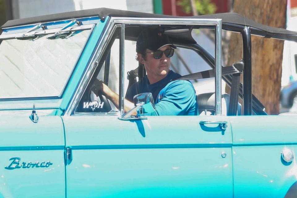 <p>Miles Teller rides with the windows down in his bright blue Ford Bronco after a workout in Los Angeles on Thursday. </p>