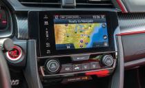 <p>The overreliance on the color red as an interior styling element and the knock-off carbon-fiber trim are a bit much for our taste, but the fit and finish inside are steps above the economy-car materials in the Veloster N.</p>