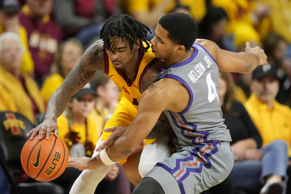 TCU guard Jameer Nelson Jr. (4) tries to steal the ball from Iowa State guard Keshon Gilbert, left, during the first half of an NCAA college basketball game, Saturday, Feb. 10, 2024, in Ames, Iowa. (AP Photo/Charlie Neibergall)