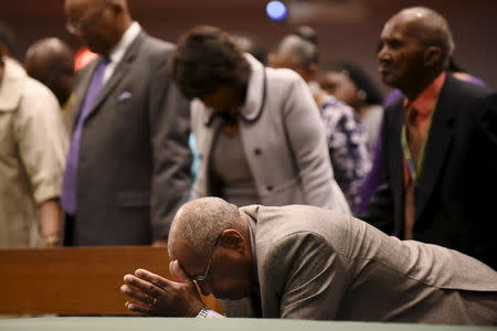 Members of the community pray during Sunday morning worship at New Shiloh Baptist Church, where Freddie Gray's April 27 funeral service was held in Baltimore, May 3, 2015. REUTERS/Sait Serkan Gurbuz