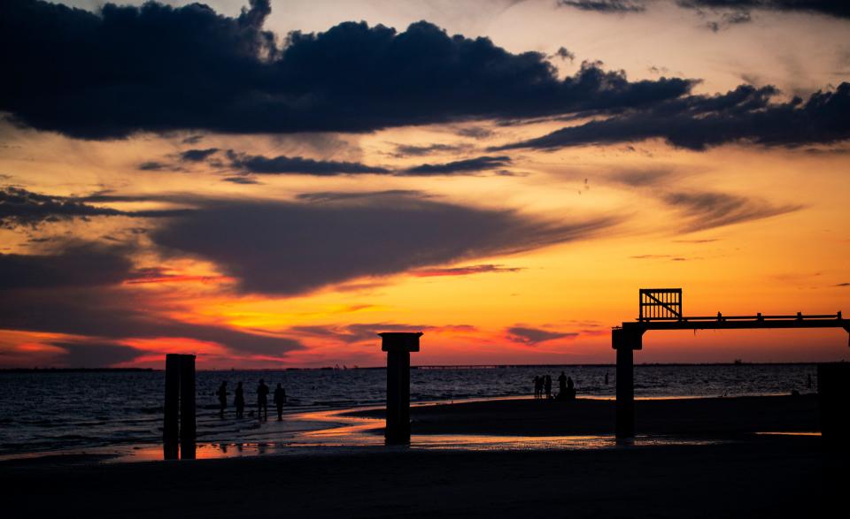 Sunset at what remains of the pier on Fort Myers Beach on Monday, Sept. 11, 2023. Southwest Florida sunsets are still stunning