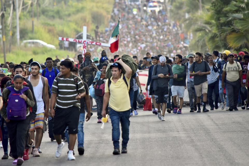 Migrants depart from Tapachula, Mexico, Sunday, Dec. 24, 2023. The caravan started the trek north through Mexico just days before U.S. Secretary of State Antony Blinken arrives in Mexico City to discuss new agreements to control the surge of migrants seeking entry into the United States. (AP Photo/Edgar Hernandez Clemente)