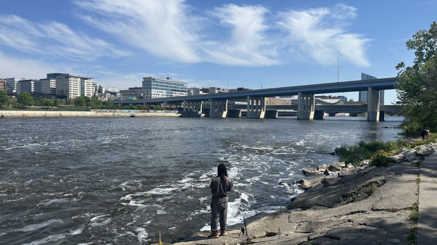 A fisherman on the Grand River in downtown Grand Rapids on May 12, 2024.