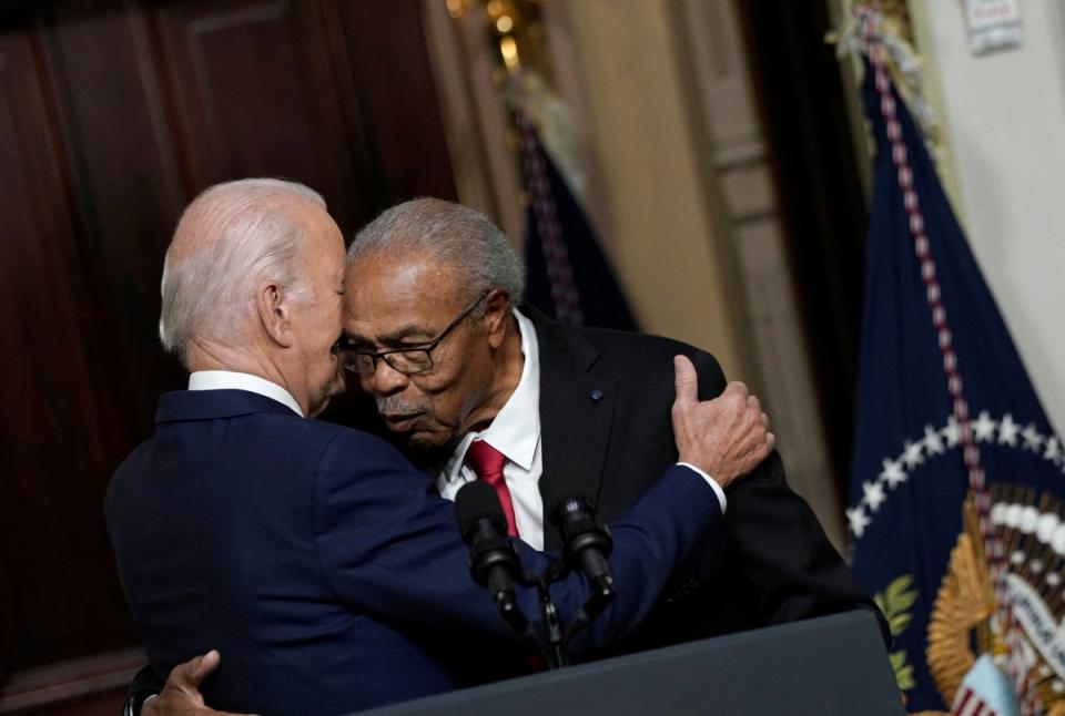 President Joe Biden embraces Rev Wheeler Parker, Emmett Till’s cousin and one of the last people to see him alive in 1955. (REUTERS)