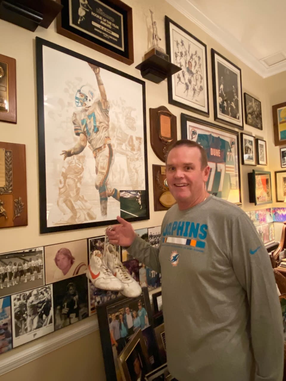 A.J. Duhe in his trophy room with the shoes from his famous game against the Jets. (Photo courtesy of Duhe)