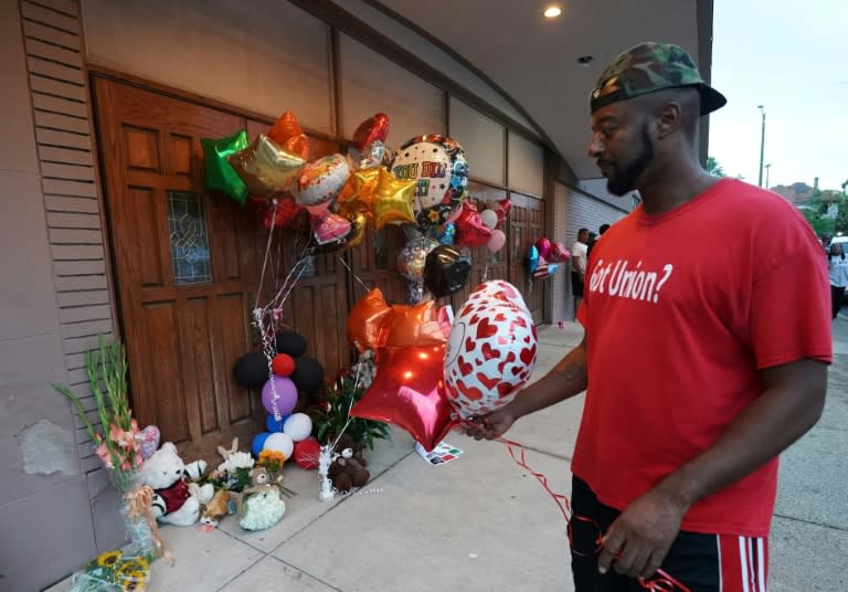 A visitor pays his respects at a makeshift memorial set up for Aretha Franklin