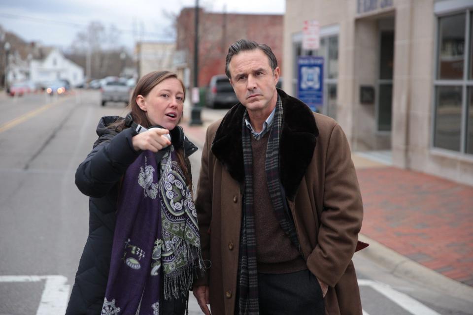 Filmmaker and city native Rebecca Tickell talks with actor David Arquette in December 2018 while filming scenes of "On Sacred Ground" downtown. She will host a showing of the movie 7 p.m. Friday at the Mill Event Center.