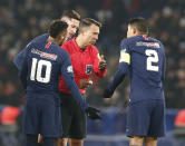 PSG's Neymar, left, and PSG' Thiago Thiago Silva, right, argue with the referee Johan Hamel during the French Cup soccer match between Paris Saint Germain and Strasbourg at the Parc des Princes stadium in Paris, Wednesday, Jan. 23, 2019. (AP Photo/Michel Euler)