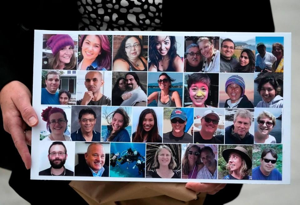 PHOTO: A photo collage of the 34 victims of the Sept. 2, 2019 fire aboard the dive boat Conception, at Santa Cruz Island, is held by a family member arriving at federal court in Los Angeles, Oct. 25, 2023.  (Damian Dovarganes/AP)