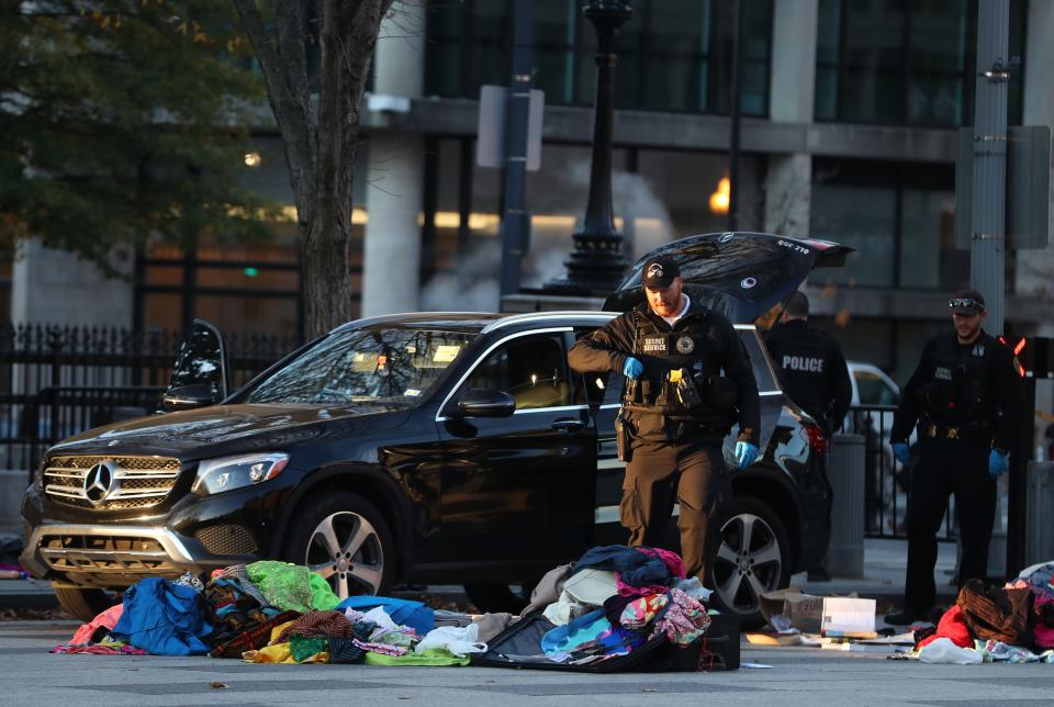 Members of the U.S. Secret Service examine belongings removed from a vehicle that tried to drive into a restricted area near the White House, on Nov. 21, 2019.