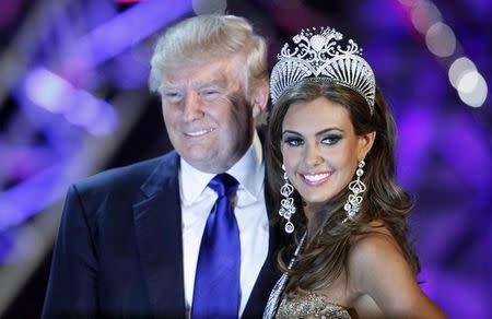 Erin Brady poses with Donald Trump, co-owner of the Miss Universe Organization, at a news conference after being crowned Miss USA 2013 at the Planet Hollywood Resort and Casino in Las Vegas, Nevada June 16, 2013. REUTERS/Steve Marcus/File Photo