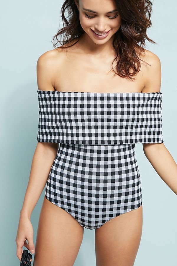 Get the suit <a href="https://www.anthropologie.com/shop/beach-riot-kinney-off-the-shoulder-one-piece-swimsuit?category=SEARCHRESULTS&amp;color=018" target="_blank">here</a>.