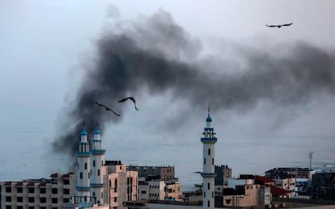 Smoke rises after an Israeli strike in northern Gaza - Credit: Photo by MAHMUD HAMS/AFP via Getty Images