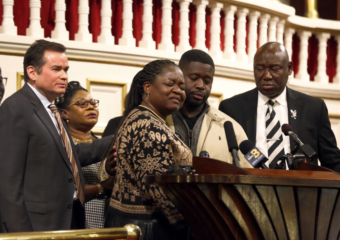 Caroline Ouko, center left, mother of Irvo Otieno, speaks of her son with attorney Mark Krudys, left, her older son, Leon Ochieng, center right, and attorney Ben Crump, right, at First Baptist Church of South Richmond, Richmond, Va., on Tuesday, March 21, 2023. (Daniel Sangjib Min/Richmond Times-Dispatch via AP)