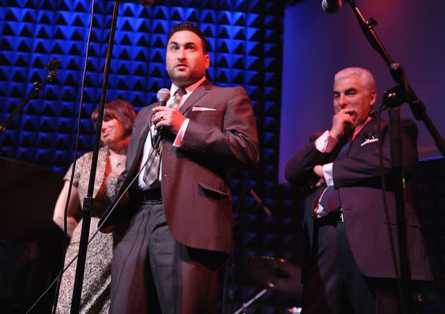 <p>Michael Loccisano/Getty</p> Alex Winehouse and Mitch Winehouse address the audience during the U.S. launch of the The Amy Winehouse Foundation on April 11, 2012 in New York City.