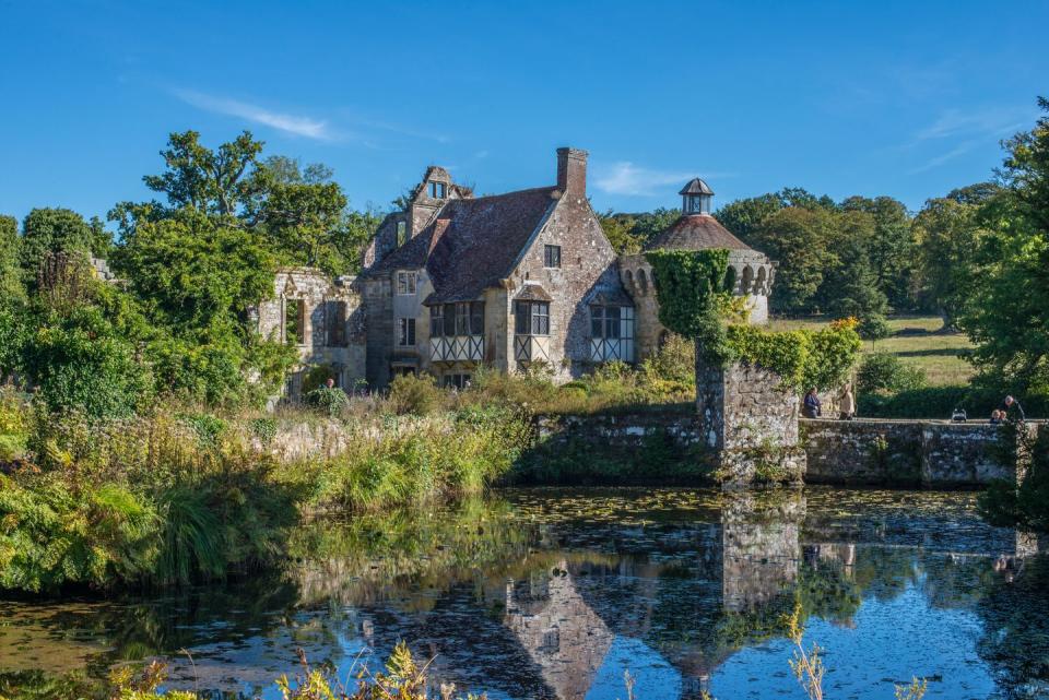 <p>This fairytale fort was once a manor house, built way back in 1380. Today, its picturesque ruins remain, adorned in climbing wisteria, roses and and clematis, and ribboned by a lake-like moat and a ruined gatehouse. Clouds of rhododendrons and azaleas abound in the gardens, with the Old Castle at their centre. </p><p>The grounds are open for picnicking once the weather brightens up, and in the autumn months they’re carpeted in deep reds and oranges.</p><p><strong>How to see it: </strong>Visit Scotney Castle, Sissinghurst and Emmetts Garden and other horticultural highlights of Kent on an <a href="https://www.countrylivingholidays.com/tours/kent-gardens-tour-carol-klein" rel="nofollow noopener" target="_blank" data-ylk="slk:early summer tour with Carol Klein;elm:context_link;itc:0;sec:content-canvas" class="link ">early summer tour with Carol Klein</a>.</p><p><a class="link " href="https://www.countrylivingholidays.com/tours/kent-gardens-tour-carol-klein" rel="nofollow noopener" target="_blank" data-ylk="slk:FIND OUT MORE;elm:context_link;itc:0;sec:content-canvas">FIND OUT MORE</a></p>