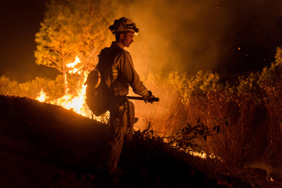 At least 63 have been killed in the widespread fire (PA)