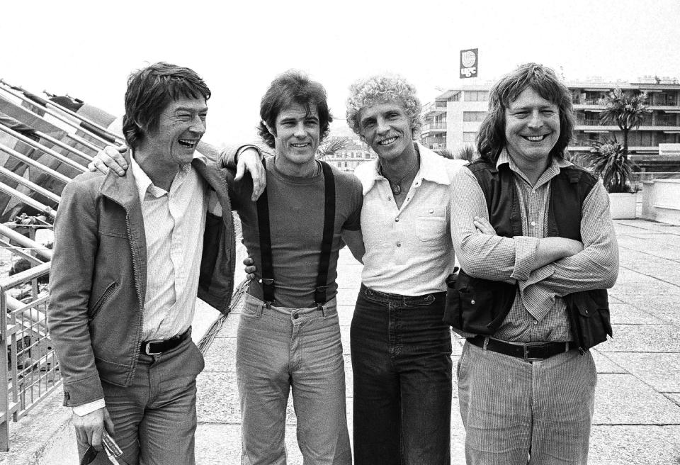 FILE - British actor John Hurt, from left, American actor Brad Davis, author Billy Hayes, and British director Alan Parker appear in Cannes, France for the screening of their film "Midnight Express" at the 31st International Film Festival on May, 18, 1978. Parker, whose movies included “Bugsy Malone,” “Midnight Express” and “Evita,” has died at the age of 76. A statement from the director’s family says Parker died Friday in London after a long illness. (AP Photo, File)