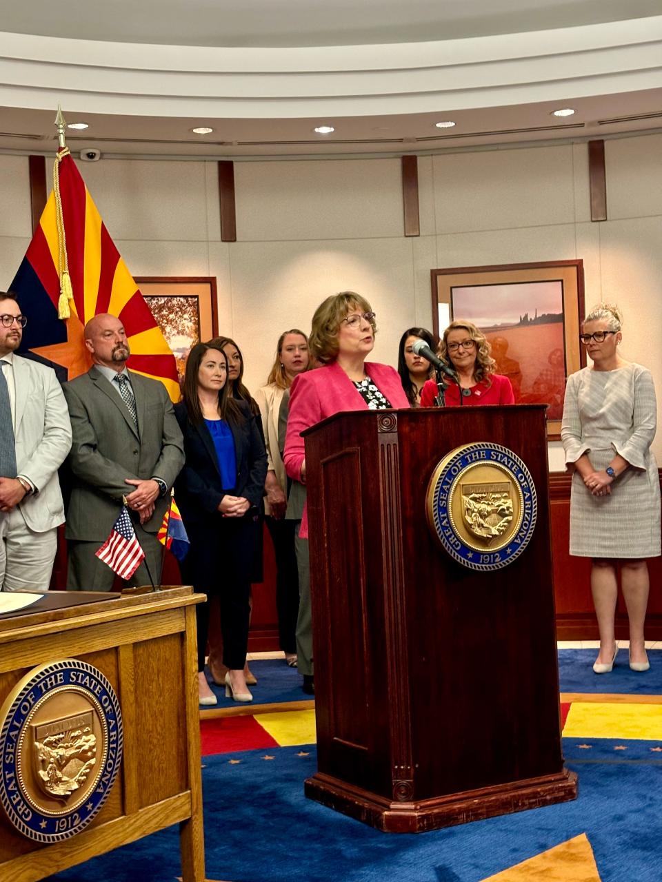 Cathy McDavid speaks at the signing of a long-term care reform bill at the Arizona state Capitol on April 8, 2024. McDavid's mother, Joann, was killed by another resident when she was living at Bethesda Gardens in North Phoenix.