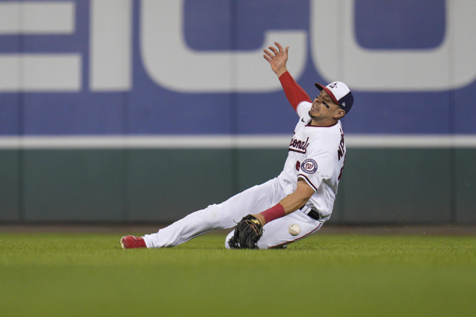 Washington Nationals right fielder Joey Meneses can't catch a ball hit for a double by Baltimore Orioles' Austin Hays during the fifth inning of a baseball game at Nationals Park, Tuesday, Sept. 13, 2022, in Washington. (AP Photo/Jess Rapfogel)