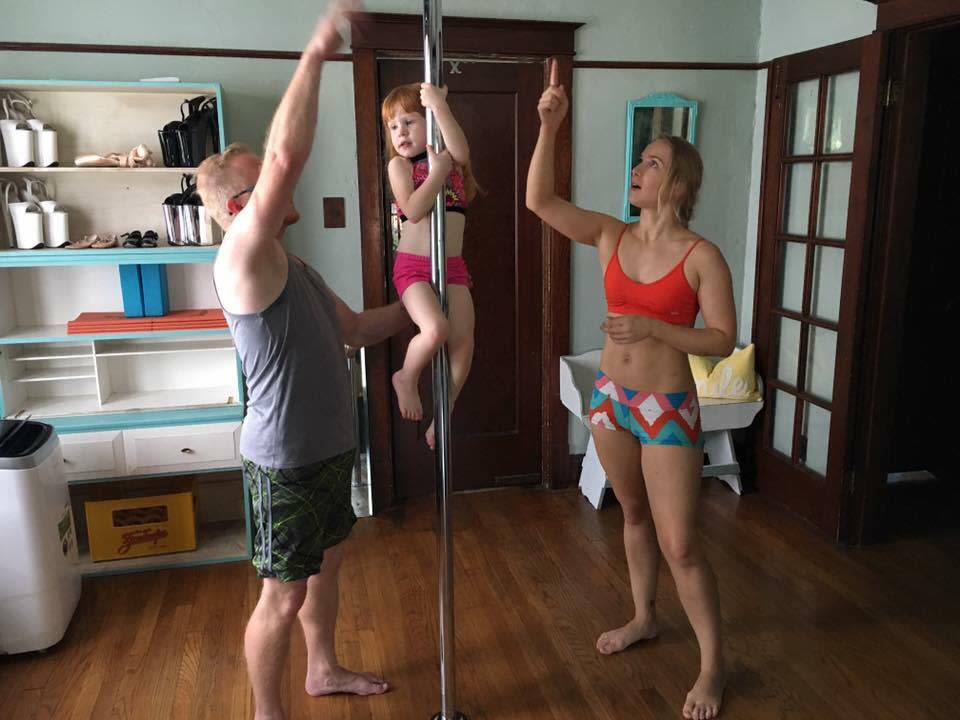 The family has a pole in their living room and the children practice every day