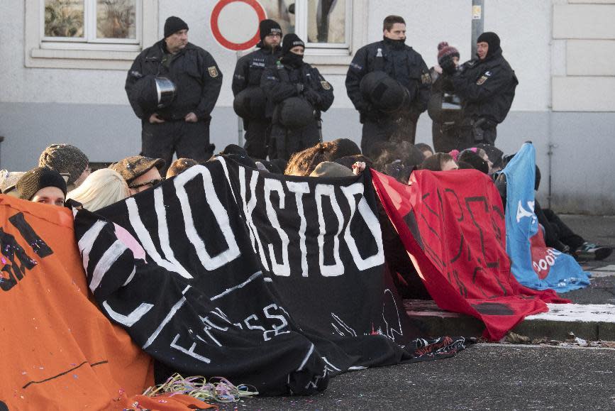 Demonstrators block the street to a hotel where a meeting of European nationalists is planned in Koblenz, Germany, Saturday, Jan. 21, 2017. Dutch populist anti-Islam lawmaker Geert Wilders, AfD (Alternative for Germany) chairwoman Frauke Petry, far-right leader and candidate for next spring presidential elections Marine le Pen from France and Italian Lega Nord chief Matteo Salvini will attend the meeting. (Boris Roessler/dpa via AP)