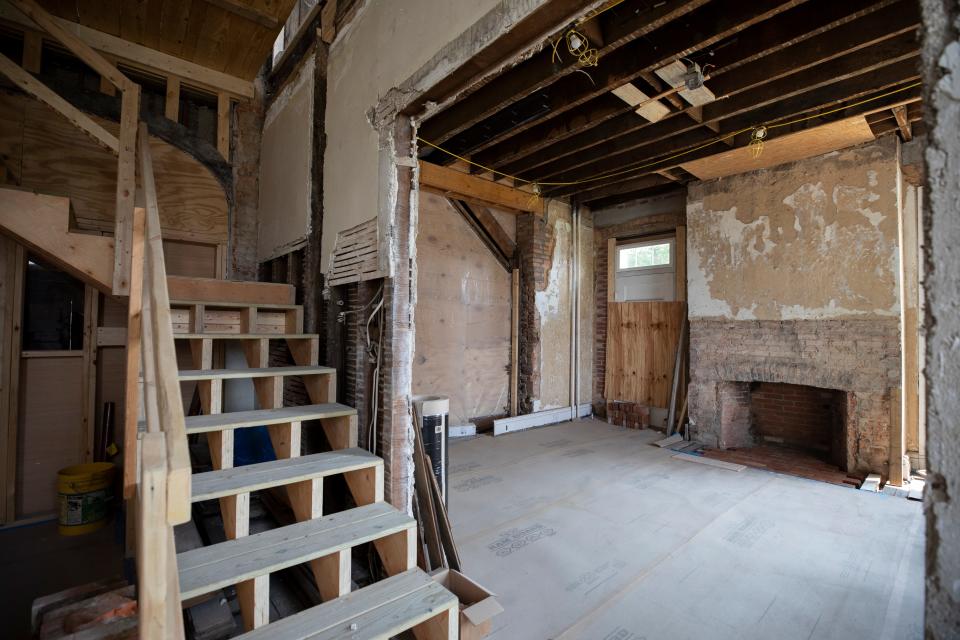 A staircase separates the original study and parlor in the Harriet Beecher Stowe House in Walnut Hills, where interior renovations will continue through 2025.