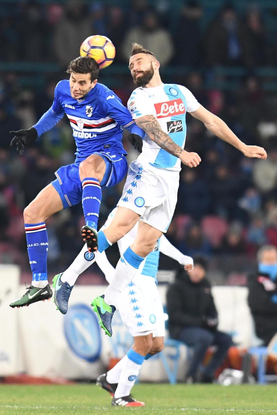 Sampdoria's Ricardo Alvarez and Napoli's Lorenzo Tonelli jump for the ball during an Italian Serie A soccer match between Napoli and Sampdoria at the San Paolo stadium in Naples, Saturday, Jan. 7, 2017. (Ciro Fusco/ANSA via AP)