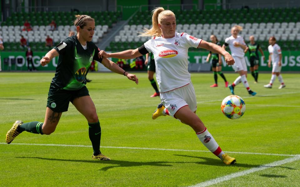 Cologne's Rachel Rinast (r) plays against Wolfsburg's Anna Blässe during the Flyeralarm Frauen Bundesliga match - GETTY IMAGES