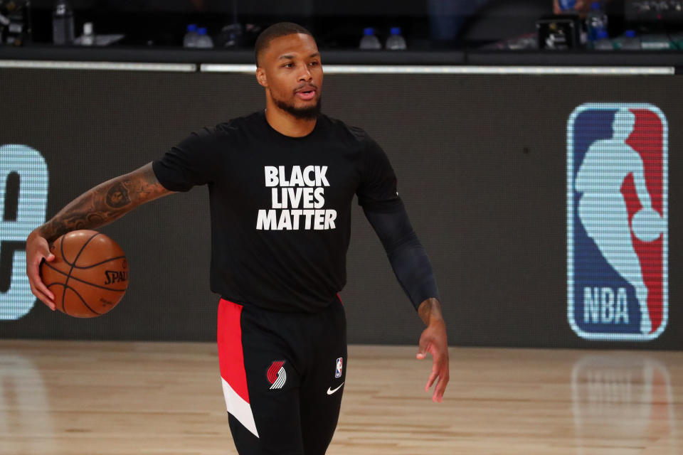 LAKE BUENA VISTA, FLORIDA - AUGUST 20:  Damian Lillard #0 of the Portland Trail Blazers warms up before action against the Los Angeles Lakers in game two of the first round of the NBA playoffs at AdventHealth Arena at ESPN Wide World Of Sports Complex on August 20, 2020 in Lake Buena Vista, Florida. NOTE TO USER: User expressly acknowledges and agrees that, by downloading and or using this photograph, User is consenting to the terms and conditions of the Getty Images License Agreement. (Photo by Kim Klement-Pool/Getty Images)