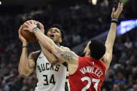 Toronto Raptors guard Fred VanVleet (23) defends against Milwaukee Bucks forward Giannis Antetokounmpo (34) during the first half of Game 5 of the NBA basketball playoffs Eastern Conference finals in Milwaukee on Thursday, May 23, 2019. (Frank Gunn/The Canadian Press via AP)