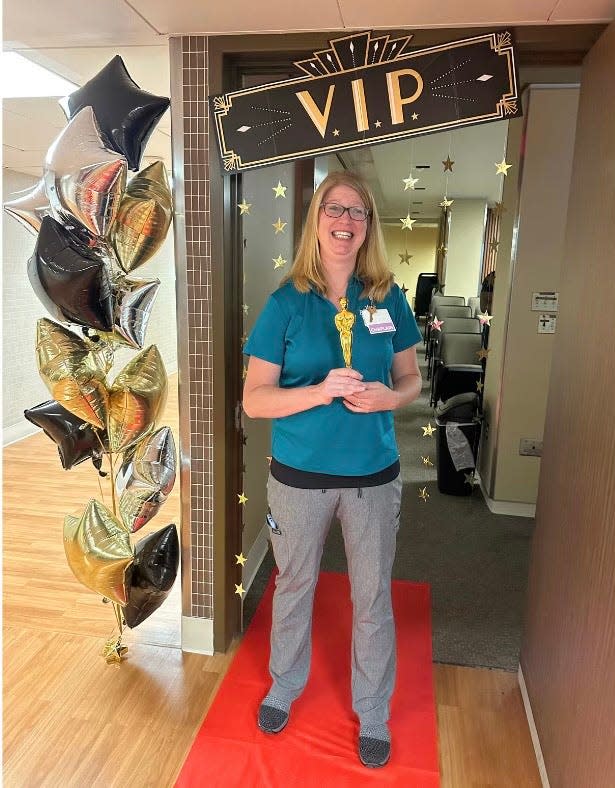 Beacon Health rolls out the red carpet for Sarah Samson, a chaplain at Memorial Hospital in South Bend, for the special video premiere of Hershey’s "Heartwarming the World" YouTube video about her handing out Hershey's chocolates to Memorial staff.
