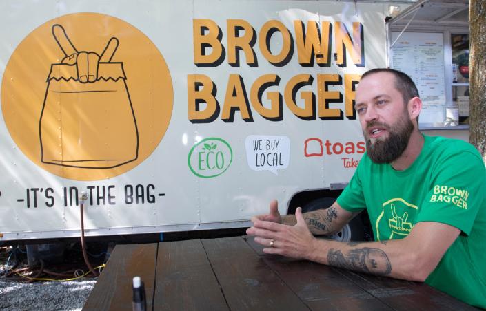 Tim Thompson, co-owner of the Brown Bagger, talks Wednesday about the food truck outside Wisteria Tavern in Pensacola.
