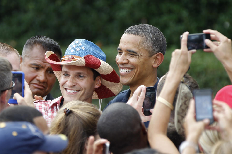 FILE - President Barack Obama poses for a photo during a visit with service members at the White House Independence Day celebration July 4, 2012, on the South Lawn of the White House in Washington. (AP Photo/Haraz N. Ghanbari, File)