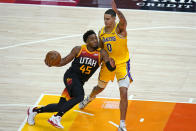 Utah Jazz guard Donovan Mitchell (45) drives against Los Angeles Lakers forward Kyle Kuzma (0) during the second half of an NBA basketball game Wednesday, Feb. 24, 2021, in Salt Lake City. (AP Photo/Rick Bowmer)