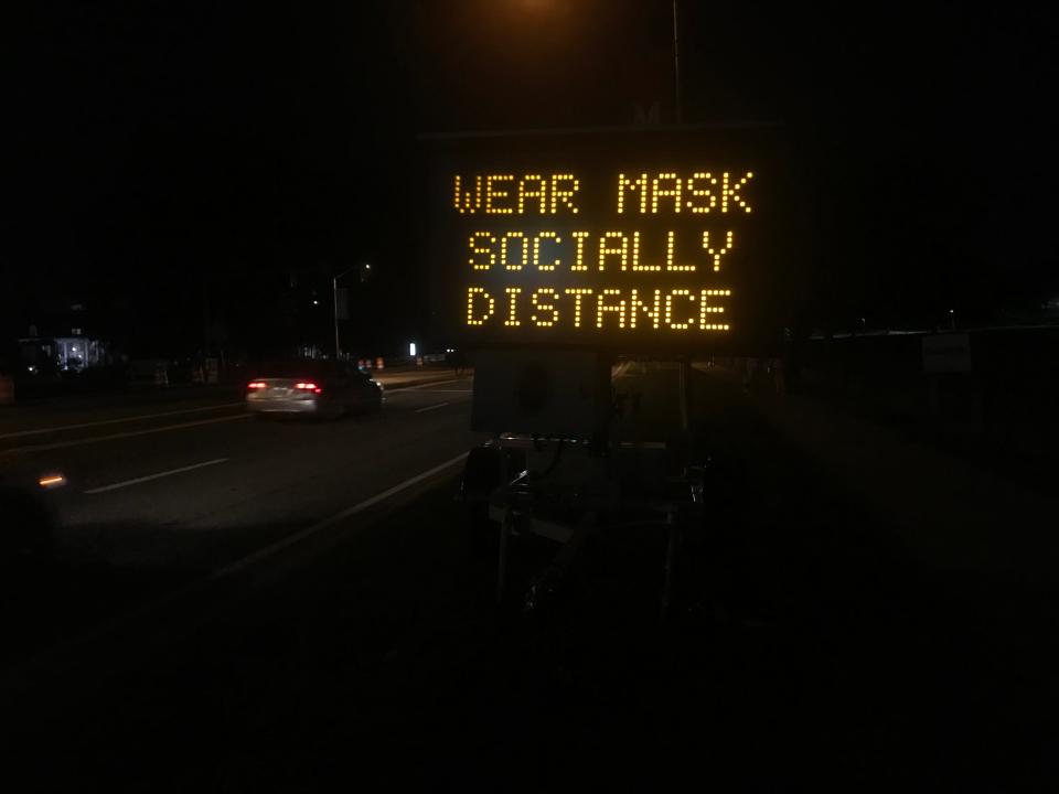 A sign near the University of Maryland campus encourages social distancing on Saturday night.