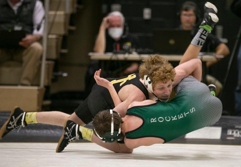 St. John Vianney's Patrick O'Keefe (left) pinned Raritan's Aidan Davis Monday night in the 106-pound bout. St. John Vianney won the match 47-28.