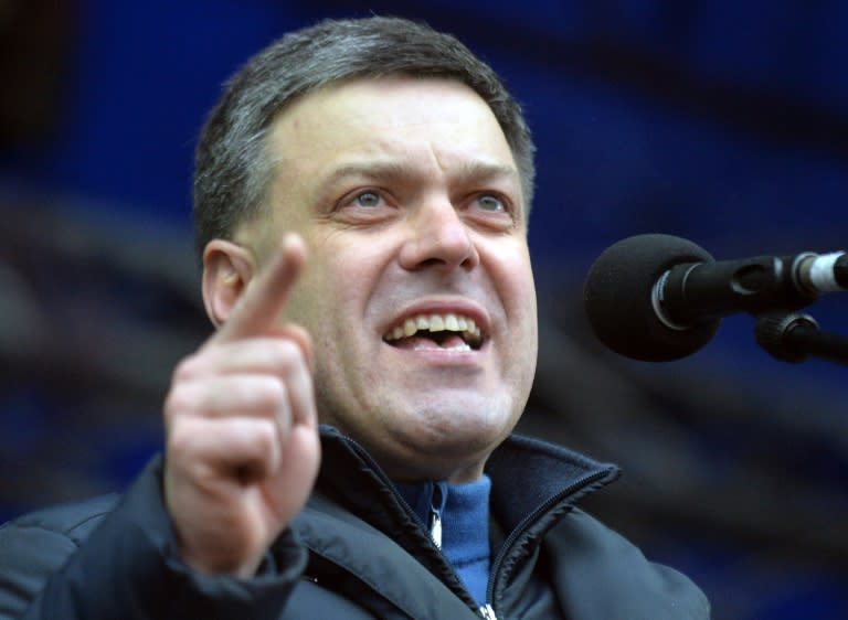 The head of Ukraine's nationalist Svoboda (Freedom) party Oleg Tyagnybok speaks on January 5, 2014 during a mass rally of the pro-European opposition on Independence Square in Kiev