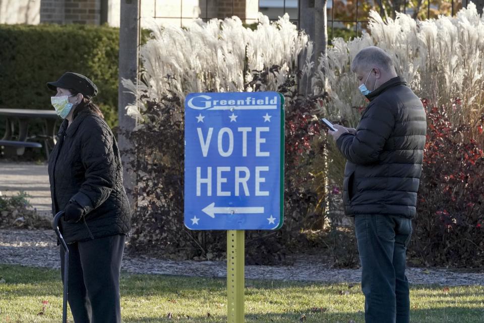 People line up to vote outside the Greenfield Community Center, Tuesday, Nov. 3, 2020, in Greenfield, Wis. Assembly Speaker Robin Vos discusses the ongoing investigation into the 2020 election he ordered in an interview with The Associated Press on Tuesday, Dec. 14, 2021. (AP Photo/Morry Gash, File)