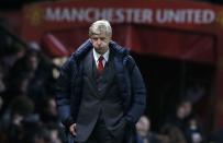 Arsenal's manager Arsene Wenger reacts during their English Premier League soccer match against Manchester United at Old Trafford in Manchester, northern England, November 10, 2013.