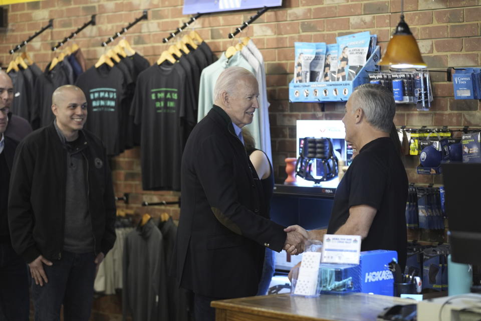 FILE - President Joe Biden greets and speaks with workers at Emmaus Run Inn during a visit to discuss his economic agenda, Jan. 12, 2024, in Emmaus, Pa. Biden is going small to try to win big in November. With 10 months to go until Election Day, the Democratic incumbent is all in on minimalist events — visits to a boba tea store, a family's kitchen and a barbershop, for example — rather than big rallies. (AP Photo/Evan Vucci, File)