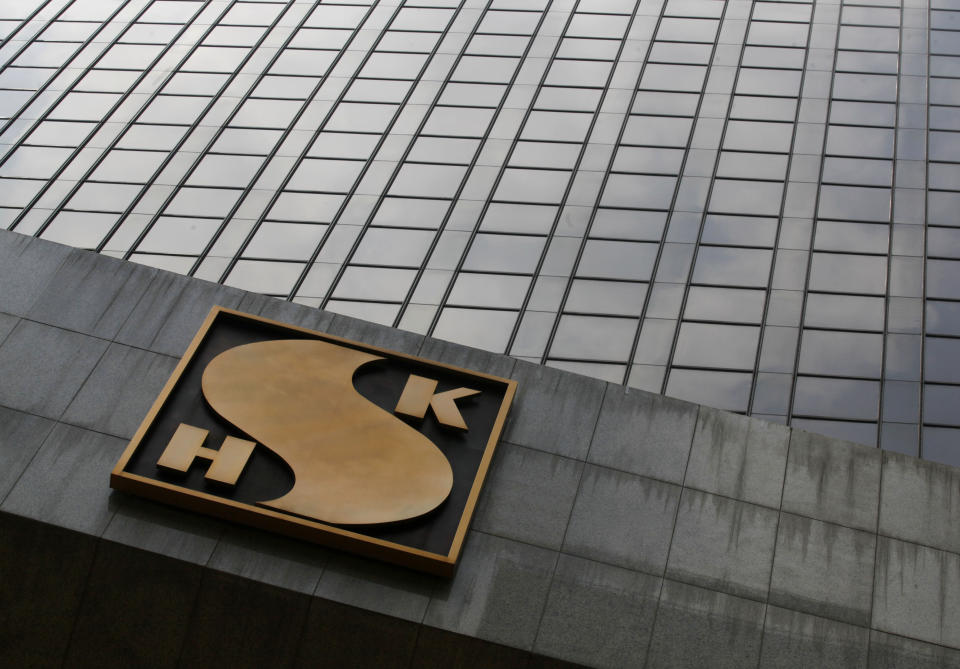 The logo of Sun Hung Kai Properties Ltd. is seen at its headquarters building in Hong Kong Friday, May 4, 2012. The former chief executive of Hong Kong developer Sun Hung Kai Properties Ltd. was arrested Thursday night in a high profile anti-corruption probe that has already targeted his billionaire brothers and a top official. (AP Photo/Kin Cheung)